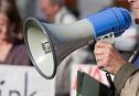 Person using megaphone at a protest